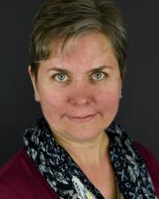 Headshot portrait of Beth M. Whittaker.